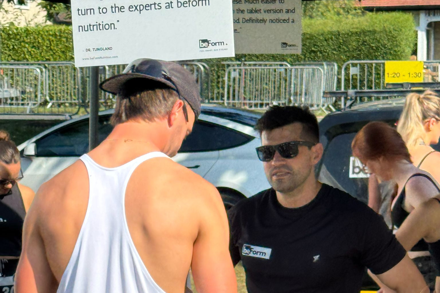Person at a race event interacting with a customer.