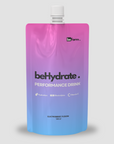 Gradient blue to pink 'behydrated' performance drink pouch on a light gray background