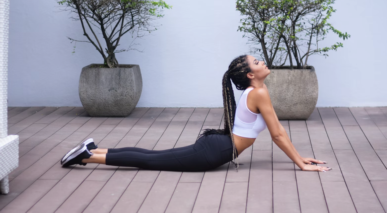 Woman doing the cobra yoga pose