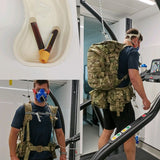 Person wearing a gas mask and backpack in a laboratory setting