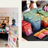 Colorful 'beStrong' supplement packages on a table with people in the background.