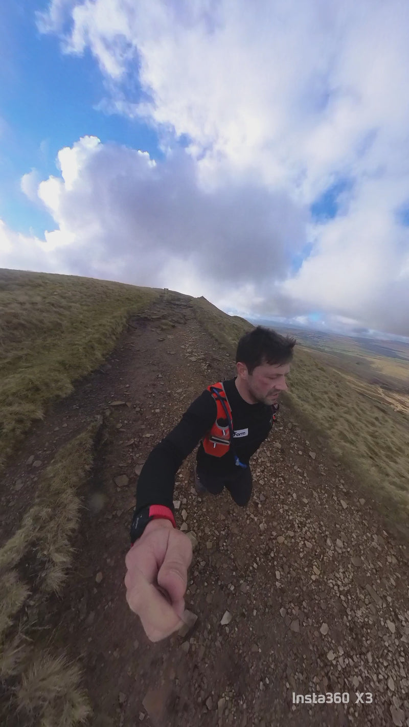 man with brown hair running in the yorkshire three peaks